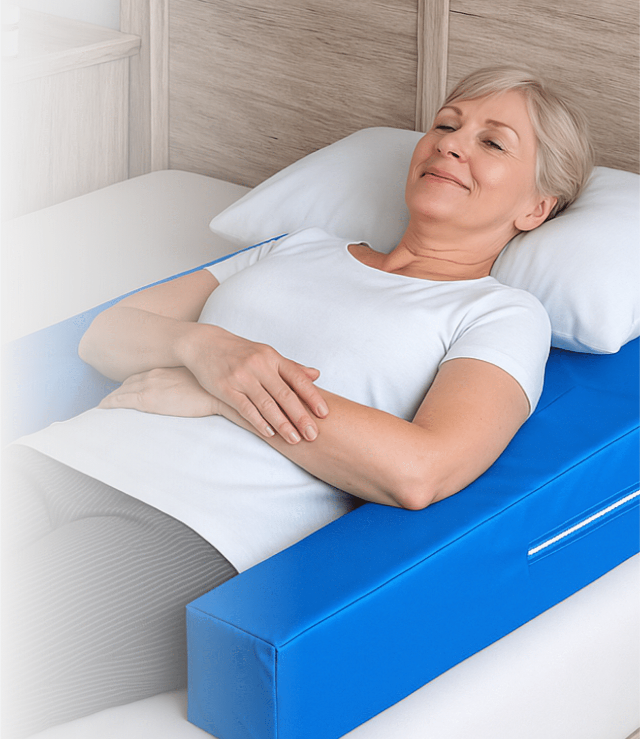 Woman peacefully sleeping on Restore You Therapeutic Support achieving restorative healing sleep with proper shoulder elevation and arm positioning for healing after surgery