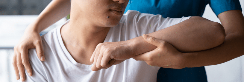 Physical Therapist Examining Patient's Biceps Tendon Tear During Clinical Assessment